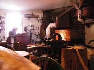 silversmith sweats over his fire